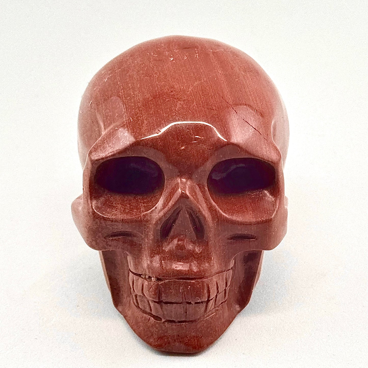 red jasper crystal skull carving