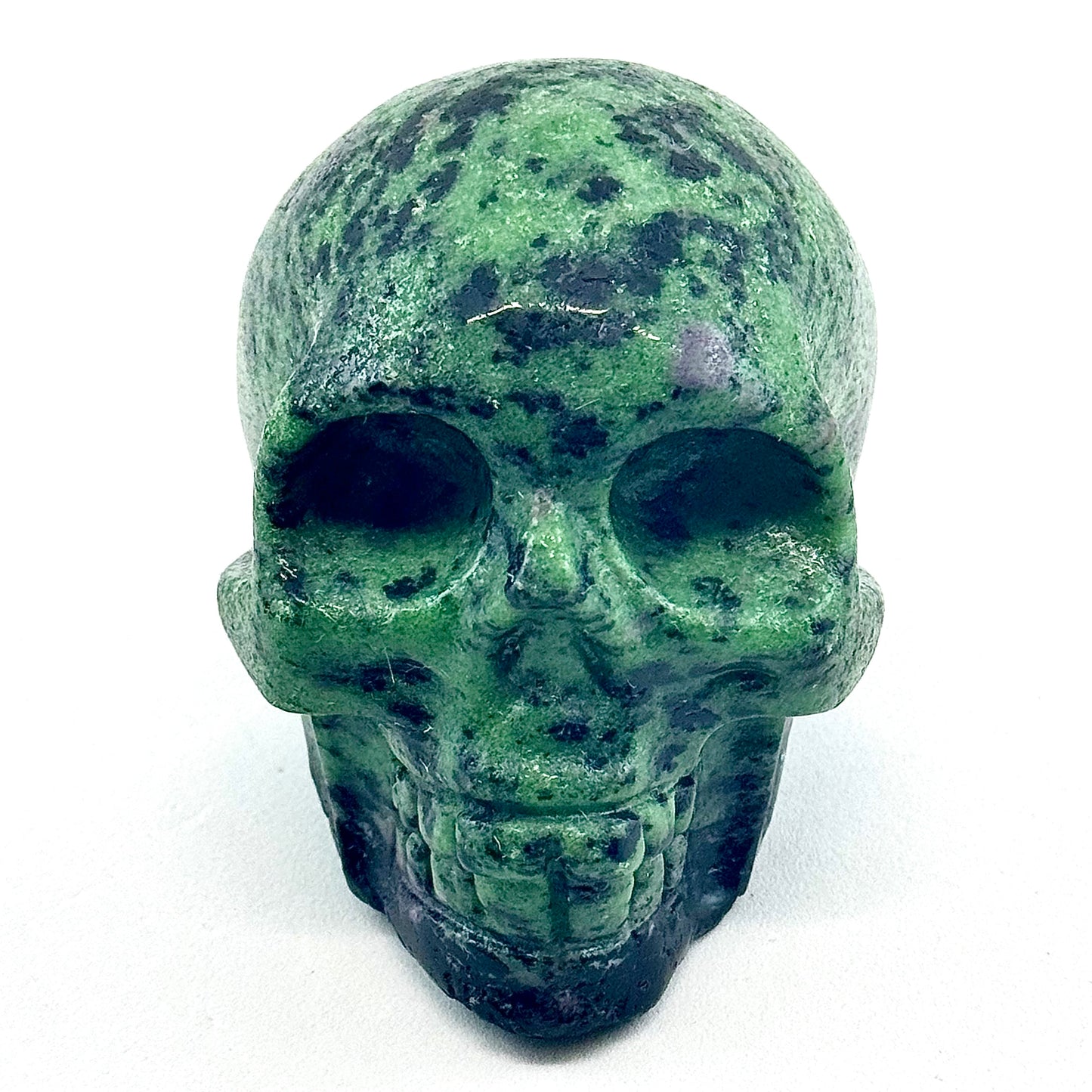 green ruby zoisite crystal skull carving